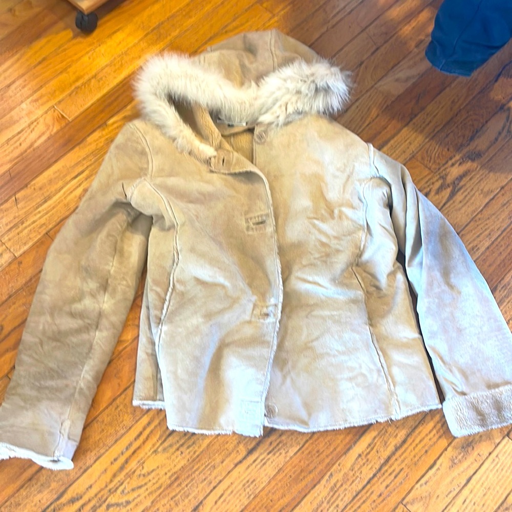 Damselle suede jacket with fur hood needs to be dry cleaned used condition.